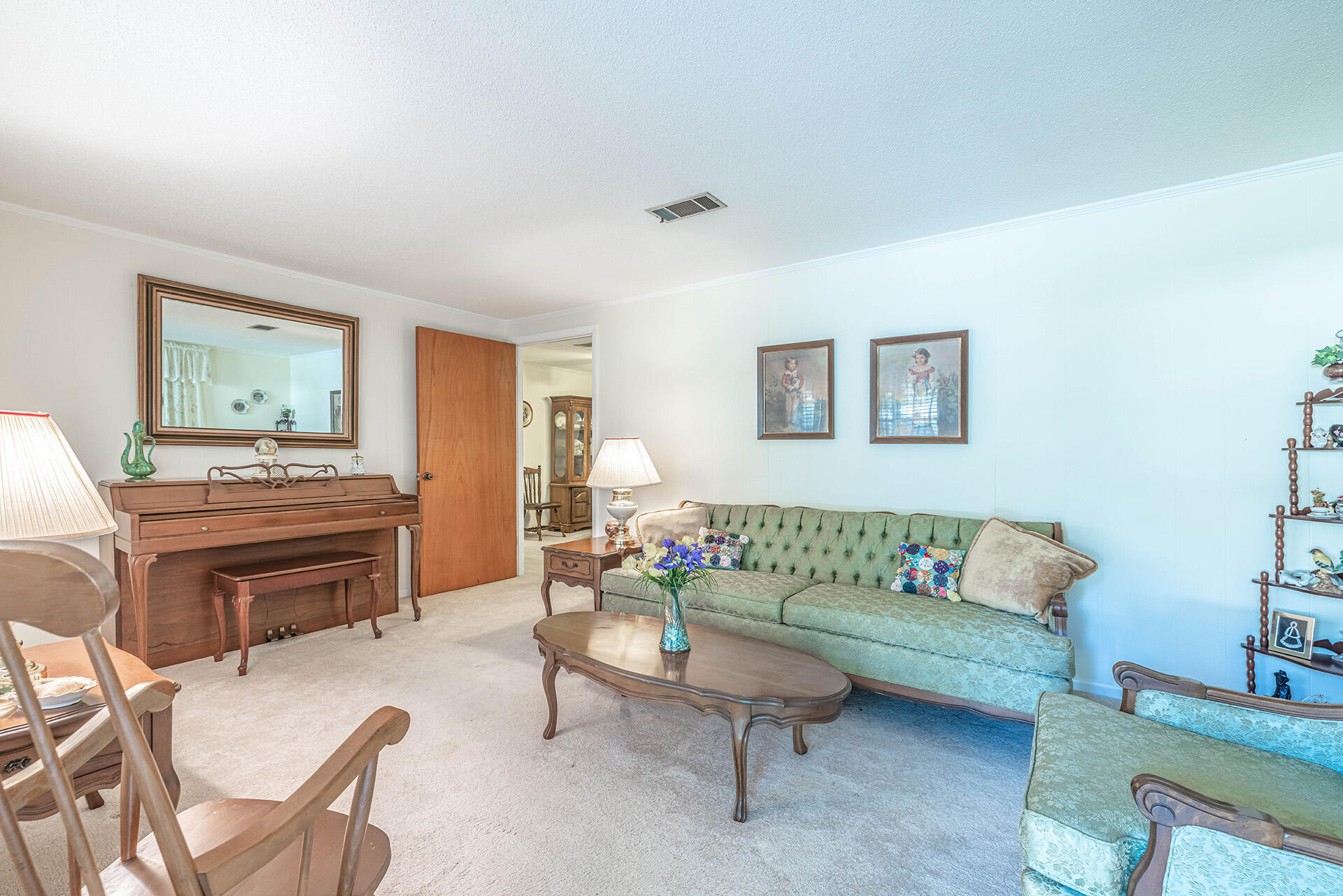 1709 Valparaiso Boulevard Niceville, FL 32578 - Photo 17 of 33 a living room with furniture and a dining table with chair