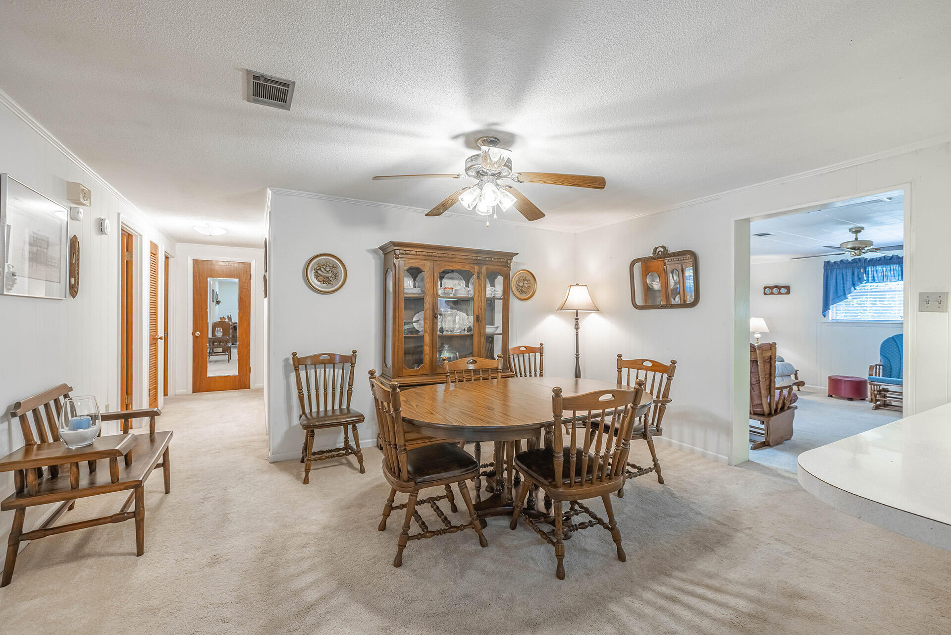 1709 Valparaiso Boulevard Niceville, FL 32578 - Photo 19 of 33 a view of a dining room with furniture and a chandelier