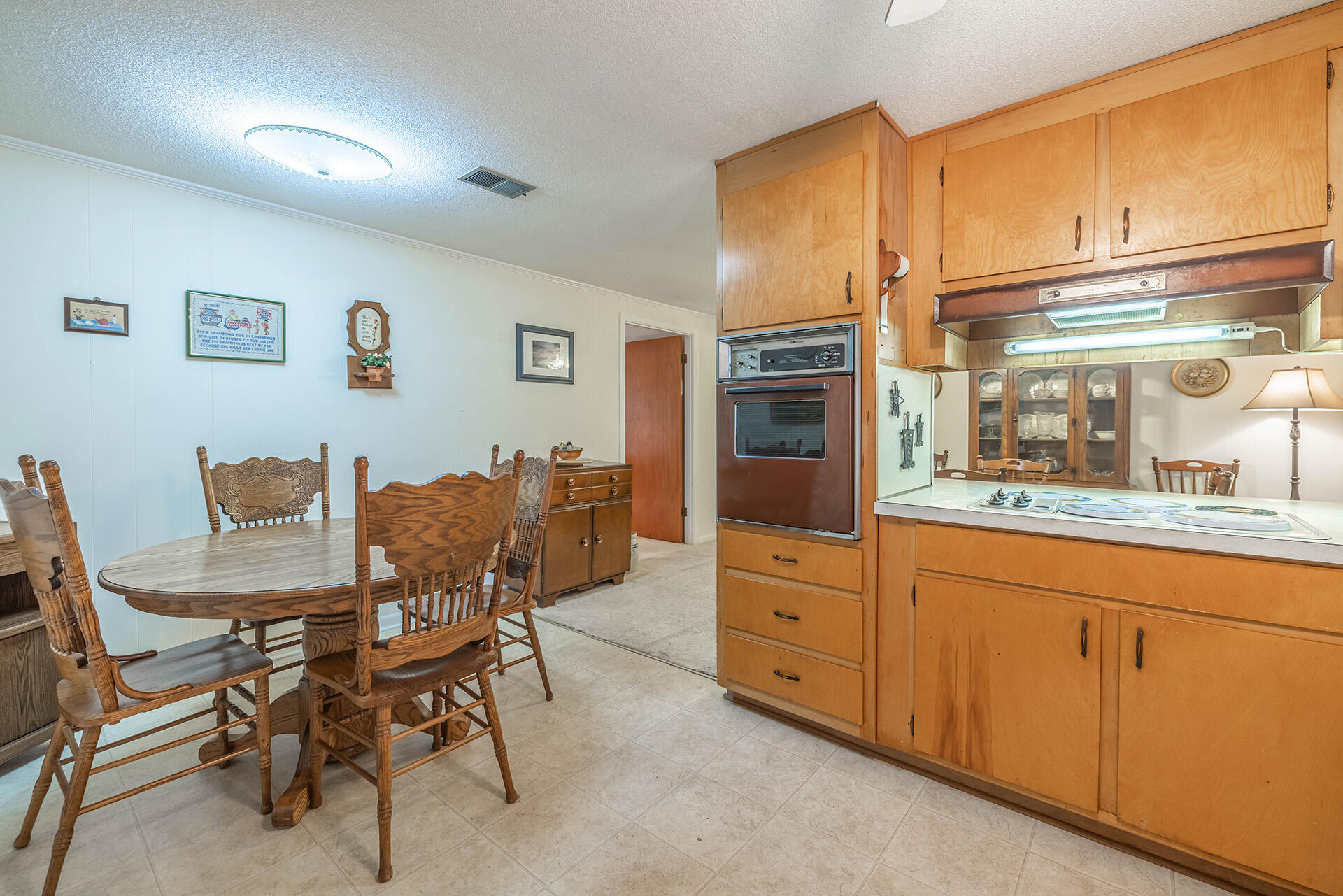1709 Valparaiso Boulevard Niceville, FL 32578 - Photo 23 of 33 a kitchen with granite countertop cabinets and chairs