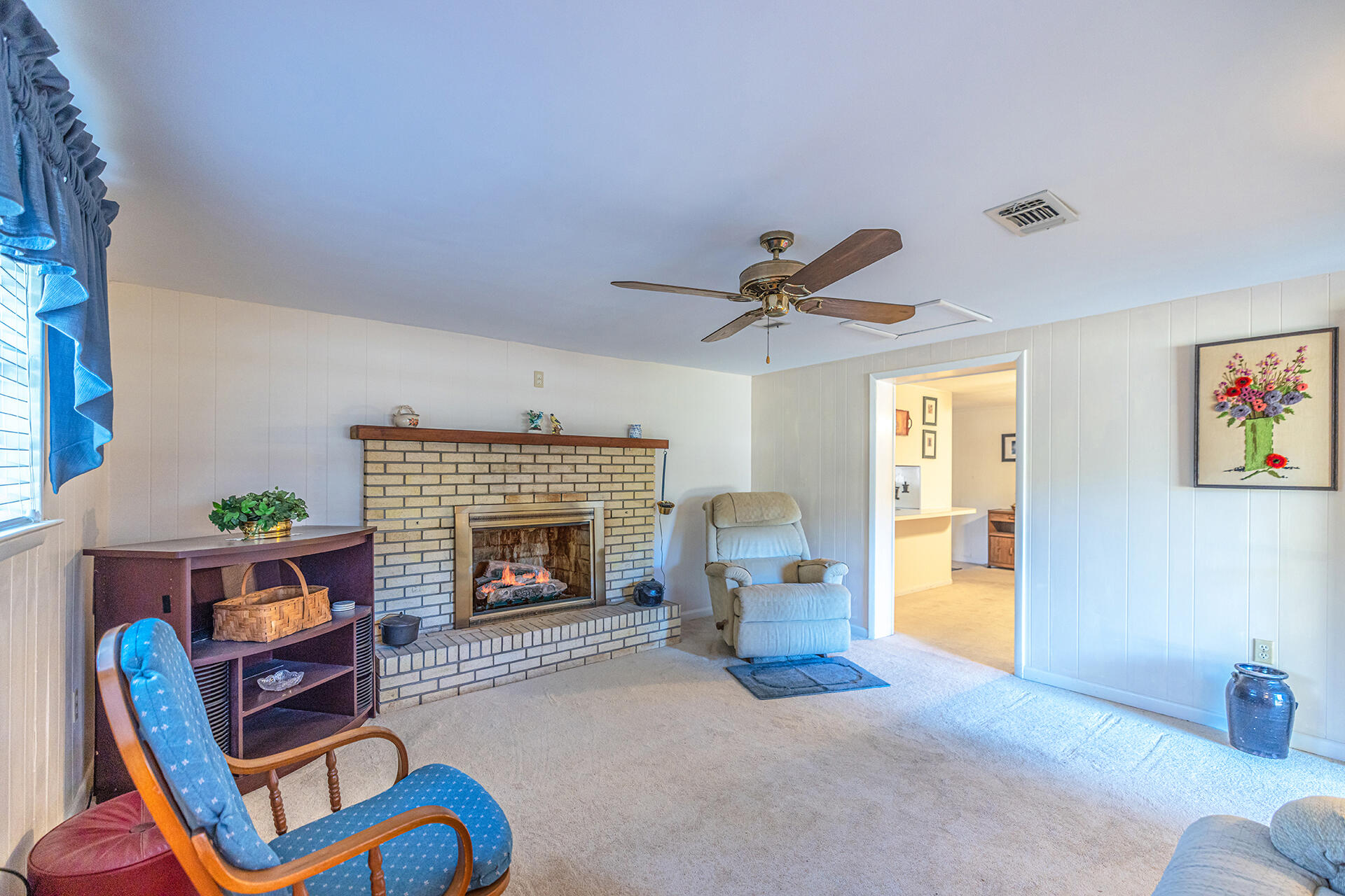1709 Valparaiso Boulevard Niceville, FL 32578 - Photo 24 of 33 a living room with furniture and a fireplace