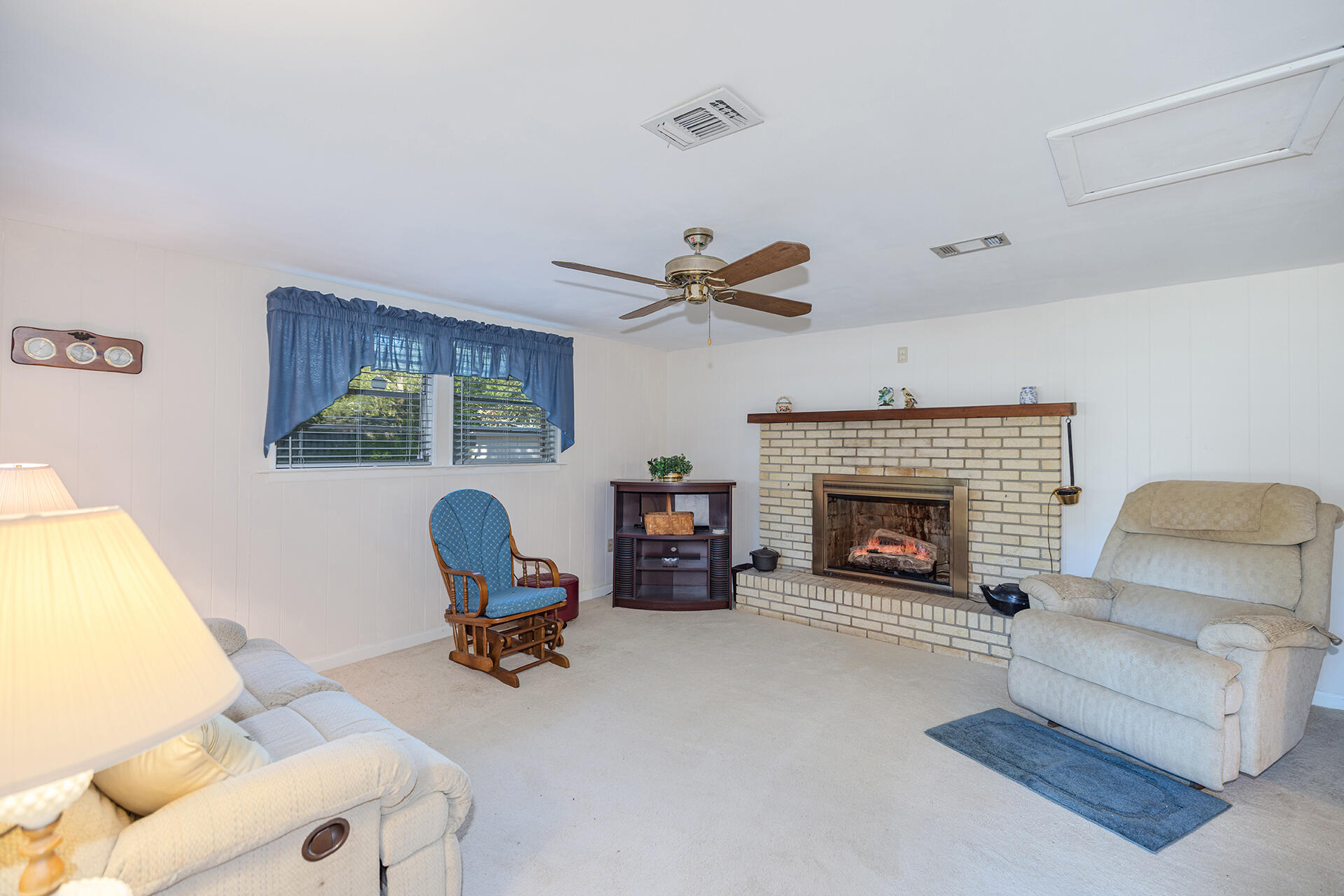 1709 Valparaiso Boulevard Niceville, FL 32578 - Photo 25 of 33 a living room with furniture and a fireplace