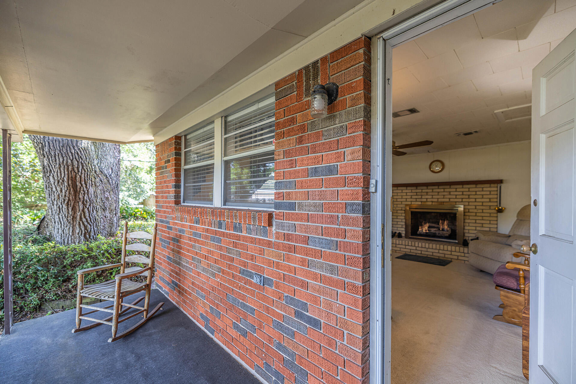 1709 Valparaiso Boulevard Niceville, FL 32578 - Photo 26 of 33 a living room with furniture and a fireplace