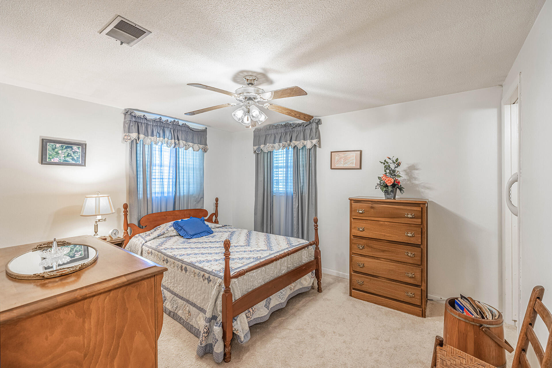 1709 Valparaiso Boulevard Niceville, FL 32578 - Photo 30 of 33 a bedroom with a bed and a chandelier