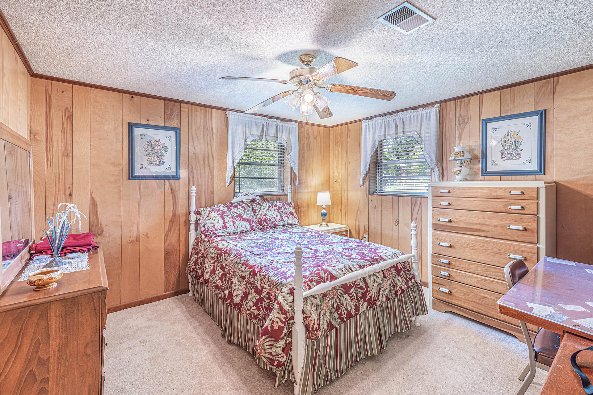 1709 Valparaiso Boulevard Niceville, FL 32578 - Photo 32 of 33 a bedroom with a bed and a chandelier