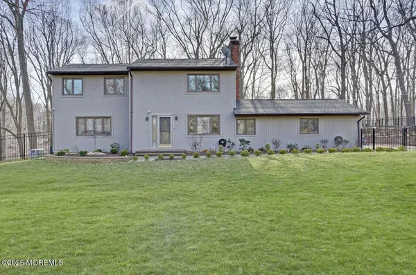 a front view of house with garden