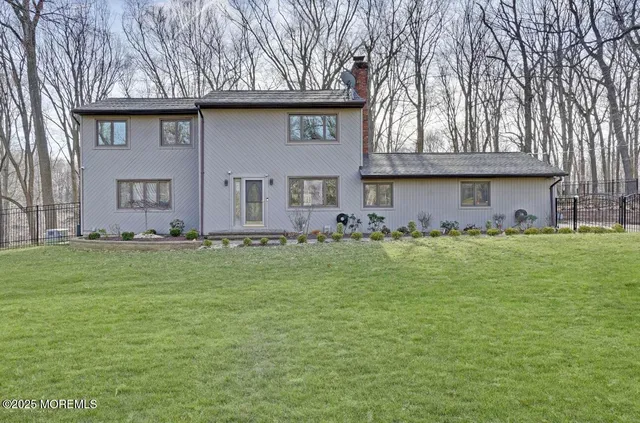 a front view of house with garden