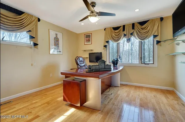 a kitchen with stainless steel appliances granite countertop a stove and a wooden floor