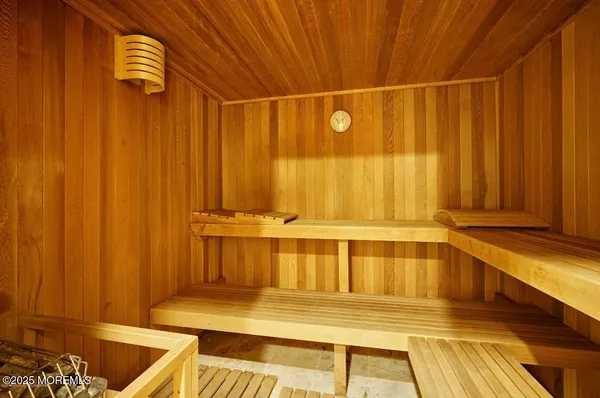 a view of a kitchen with wooden floor and a chair