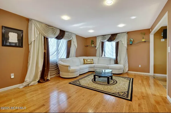 a living room with furniture and a table