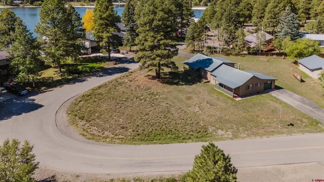 view of a lake with couches and city view