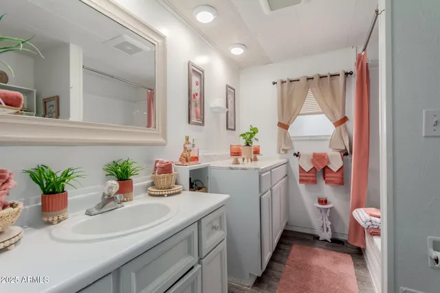 a bathroom with a sink toilet and a mirror