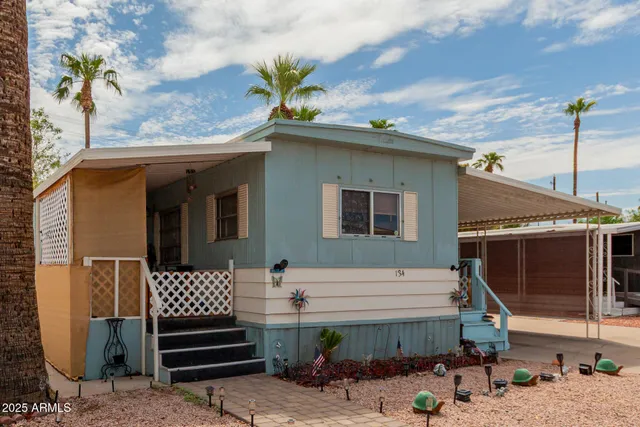 a view of a chair and tables in the patio