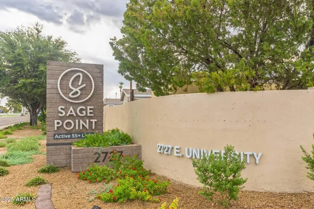 a living room with furniture a large window