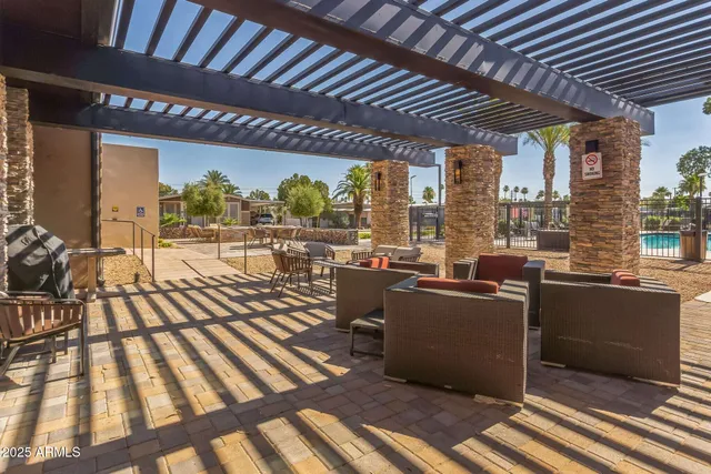 a living room with lots of furniture and a large window