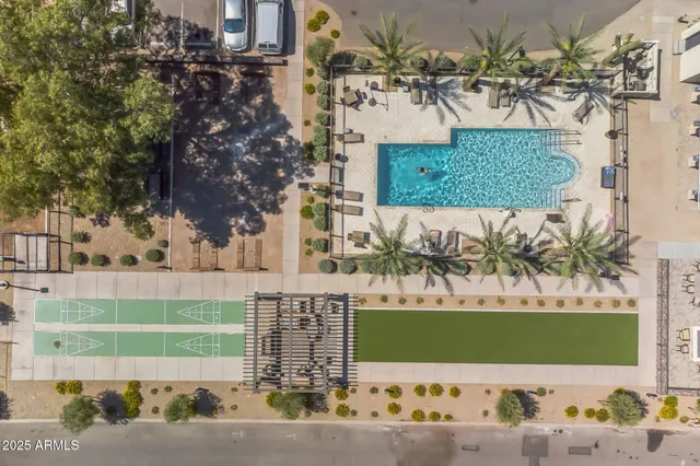a view of a swimming pool with outdoor seating