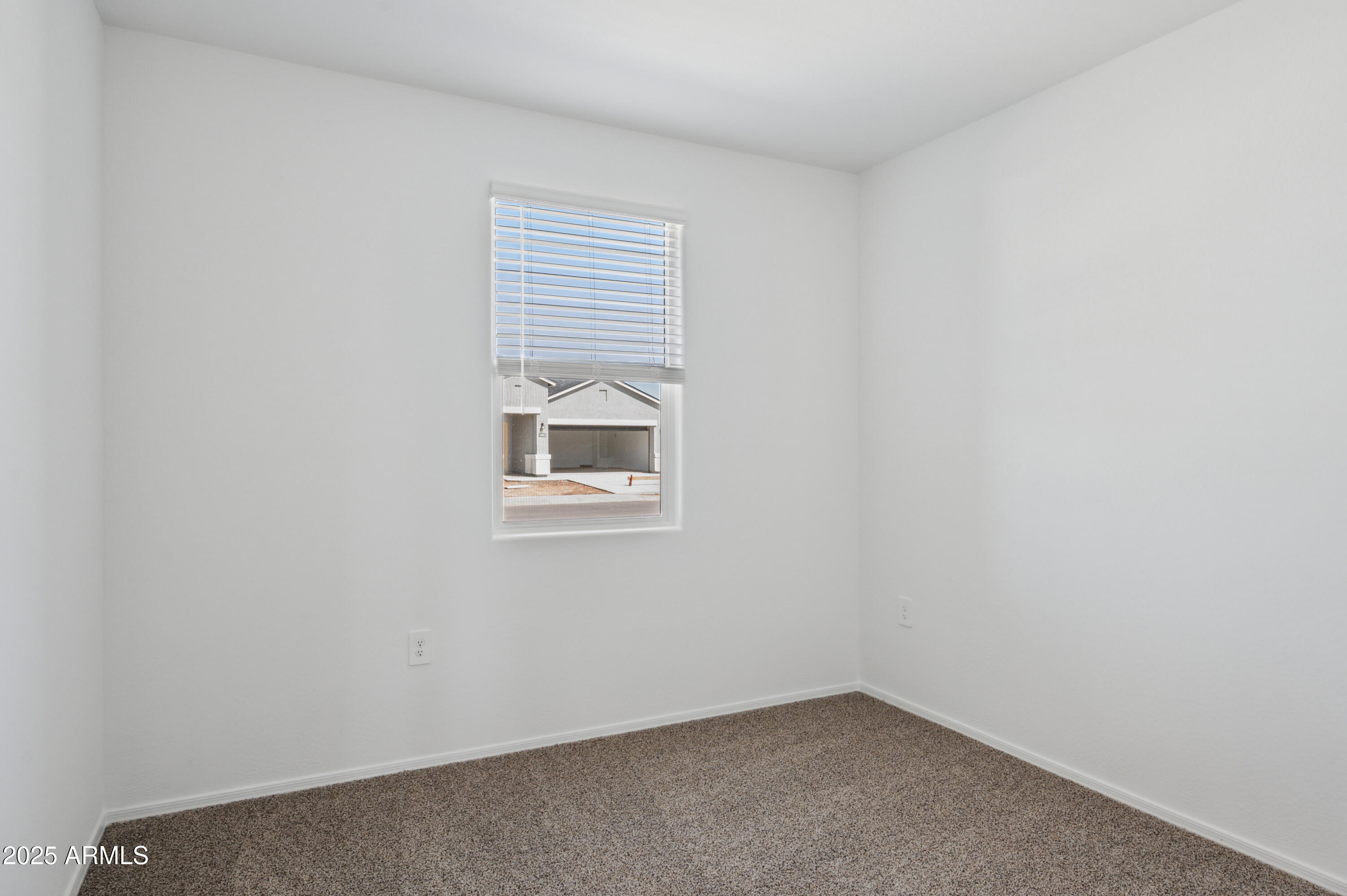 175 South Almoner Lane Casa Grande, AZ 85122 - Photo 44 of 54 an empty room with a window