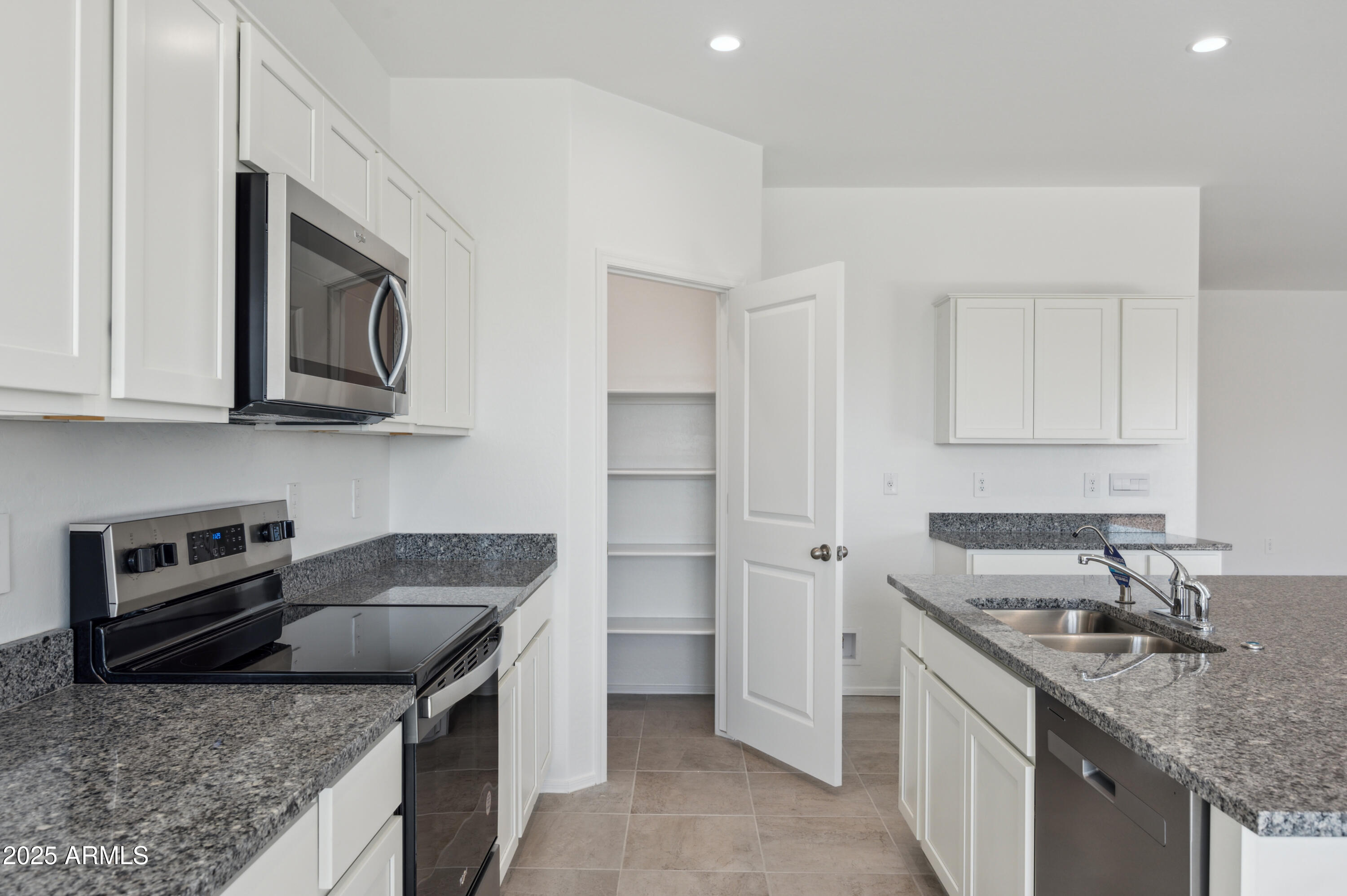 175 South Almoner Lane Casa Grande, AZ 85122 - Photo 28 of 54 a kitchen that has a sink and a stove