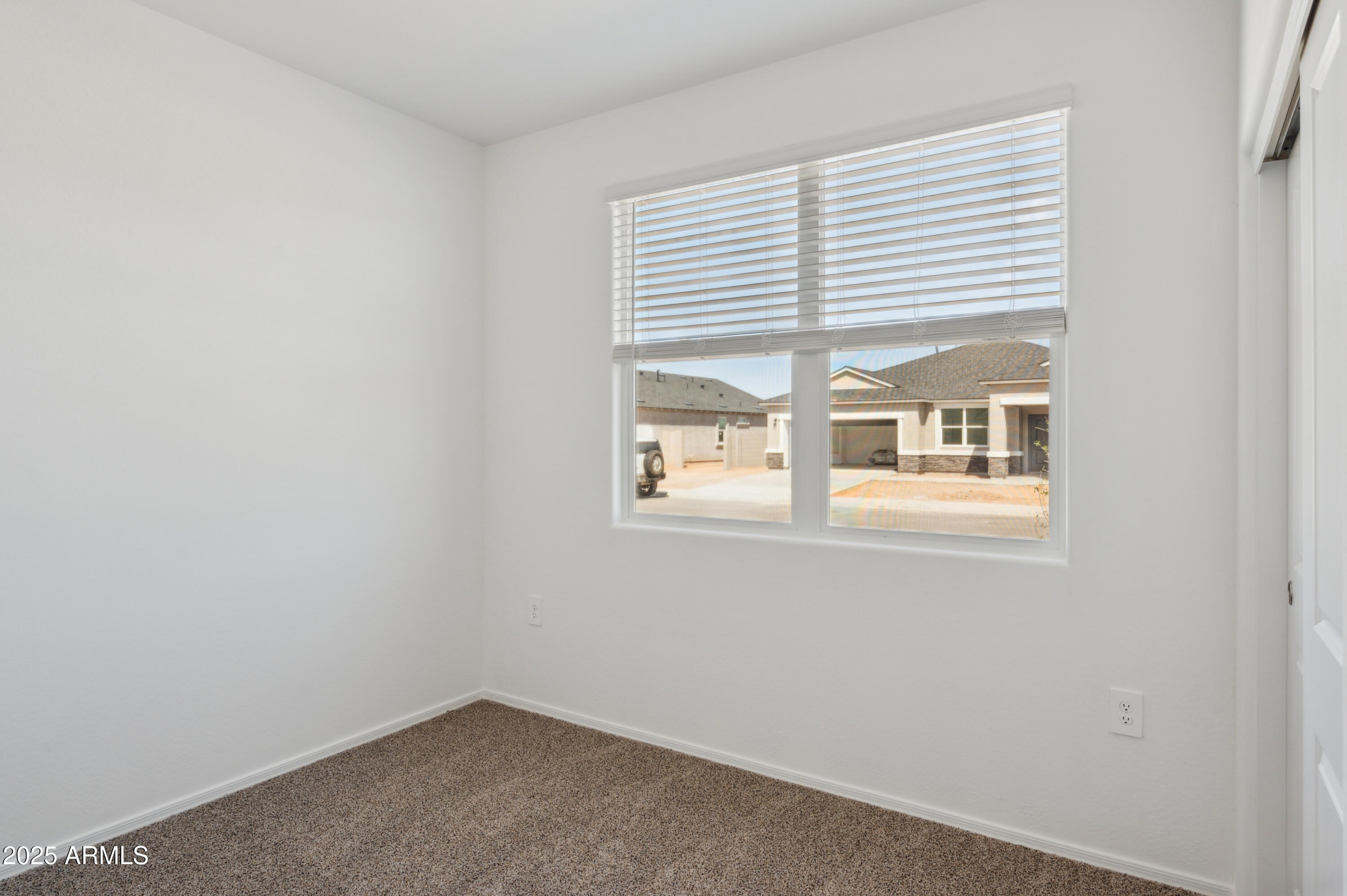 175 South Almoner Lane Casa Grande, AZ 85122 - Photo 48 of 54 a view of an empty room with a window