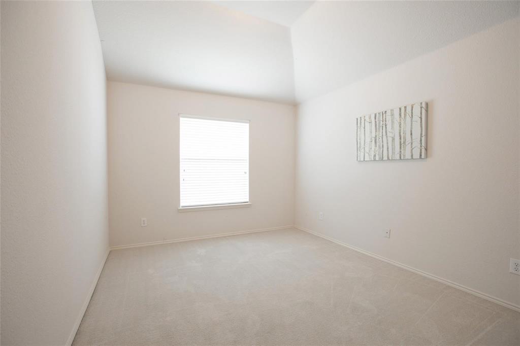 9305 Amber Downs Drive McKinney, TX 75072 - Photo 19 of 28 an empty room with a window