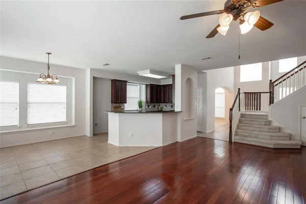 a kitchen with stainless steel appliances granite countertop wooden cabinets a sink and a stove