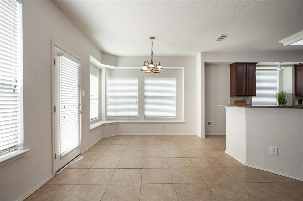 9305 Amber Downs Drive McKinney, TX 75072 - Photo 7 of 28 a view of an empty room with a window