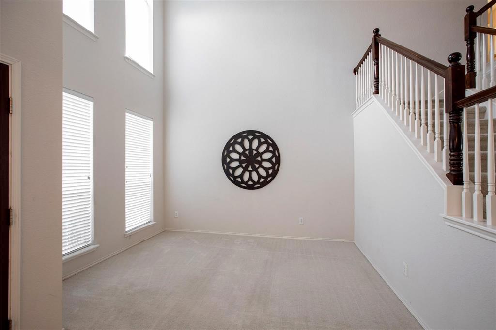 9305 Amber Downs Drive McKinney, TX 75072 - Photo 8 of 28 a view of an empty room with a window