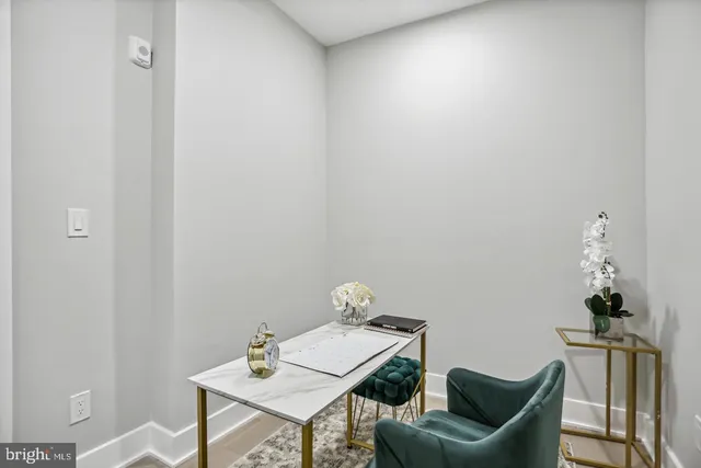 a view of a workspace with furniture