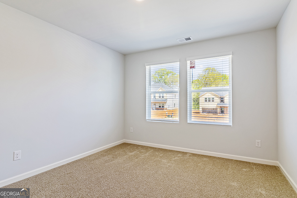 211 Agriculture Lane, Unit 9 Perry, GA 31069 - Photo 29 of 48 an empty room with a window