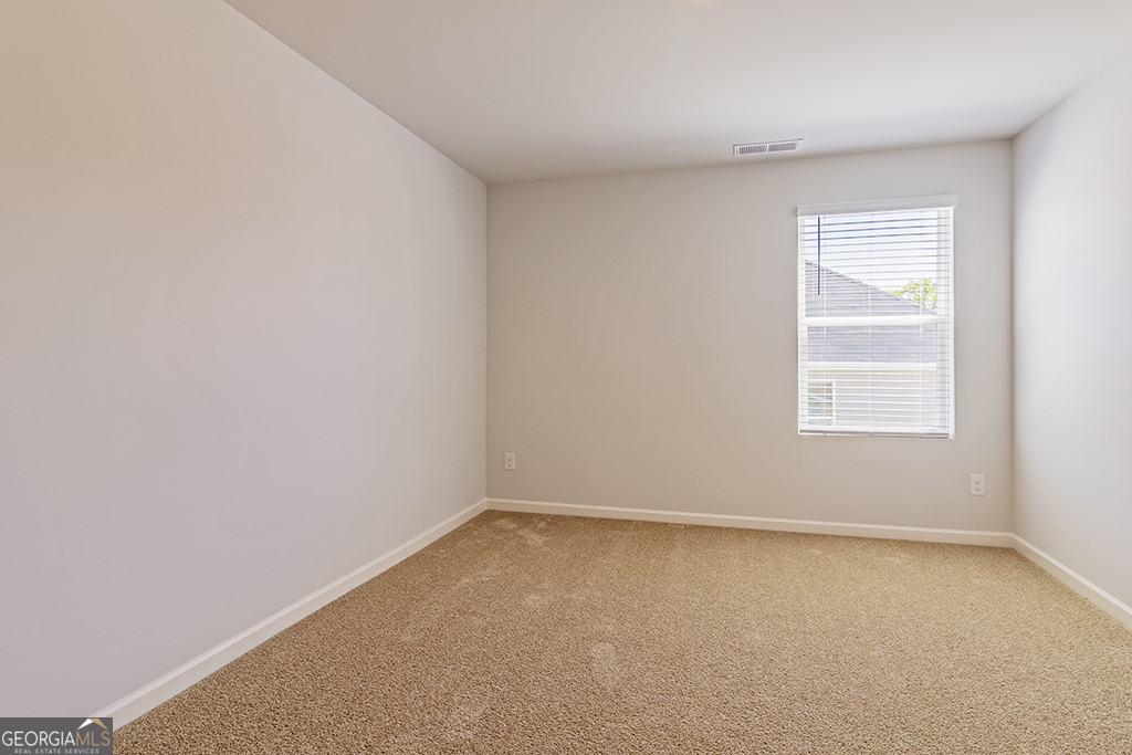 211 Agriculture Lane, Unit 9 Perry, GA 31069 - Photo 34 of 48 an empty room with a window