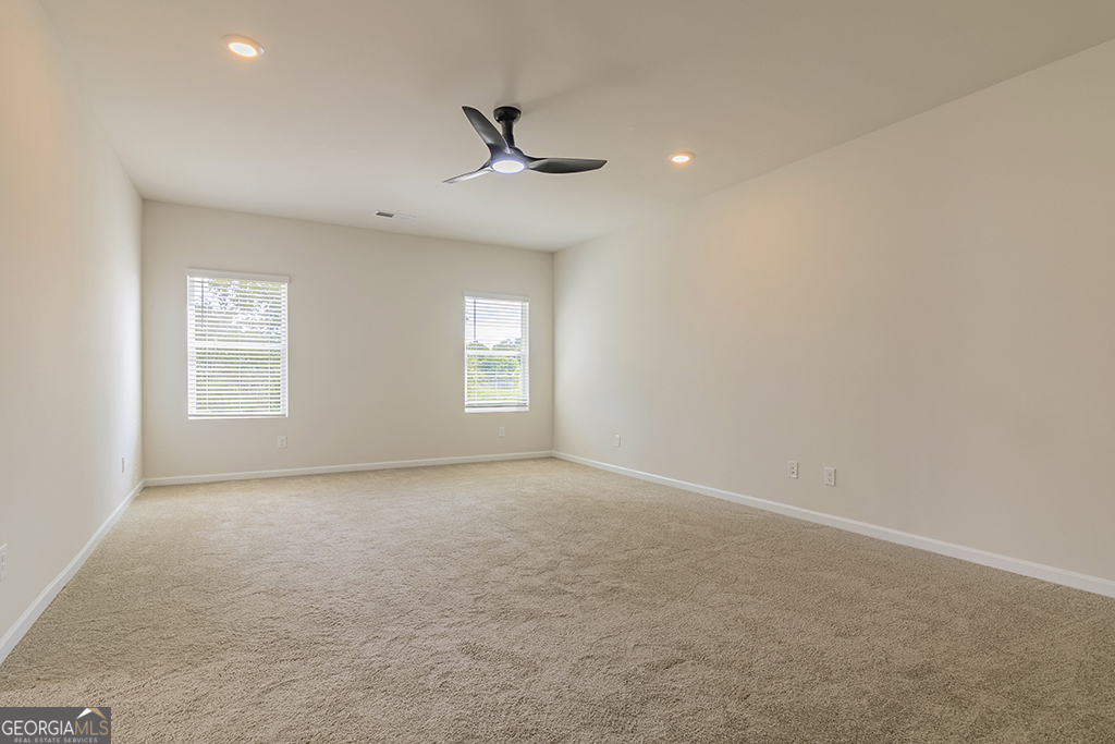 211 Agriculture Lane, Unit 9 Perry, GA 31069 - Photo 47 of 48 an empty room with windows and fan