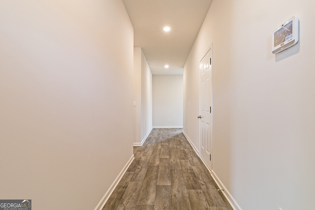 211 Agriculture Lane, Unit 9 Perry, GA 31069 - Photo 8 of 48 a view of a hallway with wooden floor
