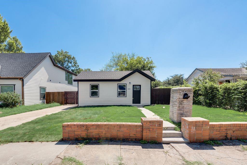 2826 Sharon Street Dallas, TX 75211 - Photo 1 of 1 a view of a house with a yard and sitting area