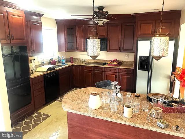 a kitchen with a sink and wooden cabinets