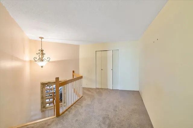 a view of a hallway to a bedroom