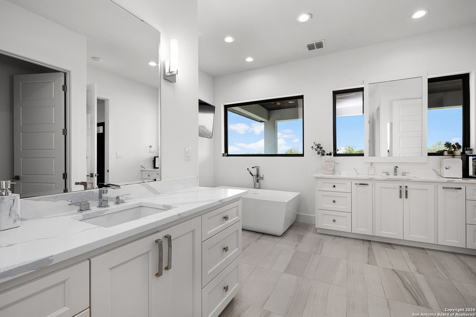 140 Rio Azul Seguin, TX 78155 - Photo 15 of 34 a spacious bathroom with a double vanity sink mirror and bathtub