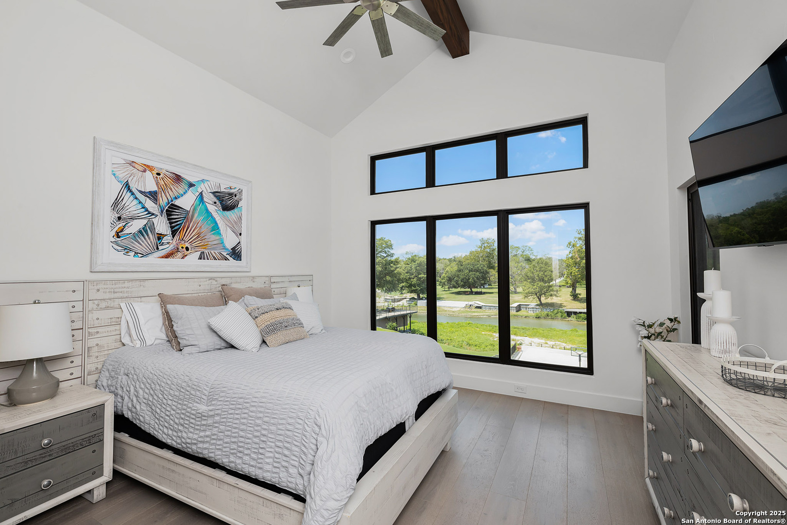 140 Rio Azul Seguin, TX 78155 - Photo 25 of 34 a bedroom with a large bed and a large window