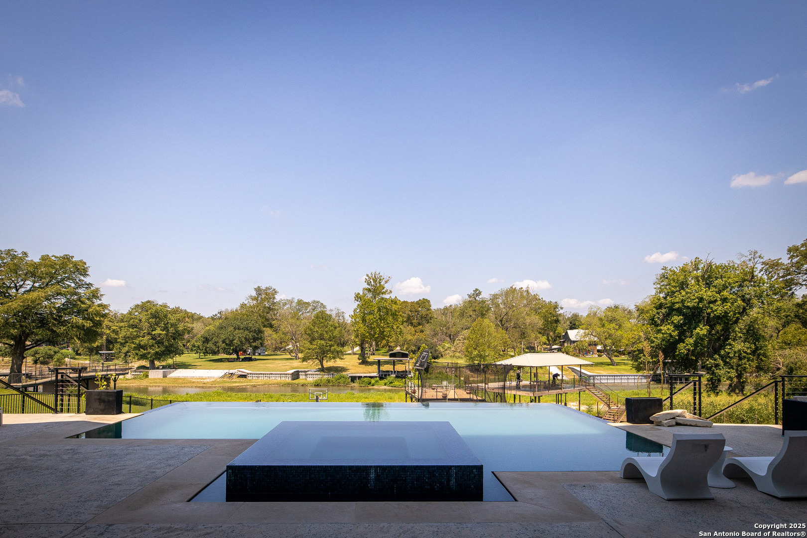 140 Rio Azul Seguin, TX 78155 - Photo 29 of 34 a view of swimming pool with outdoor seating and a garden