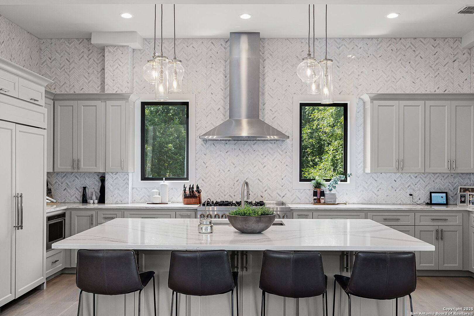140 Rio Azul Seguin, TX 78155 - Photo 9 of 34 a kitchen with a dining table chairs sink and white cabinets