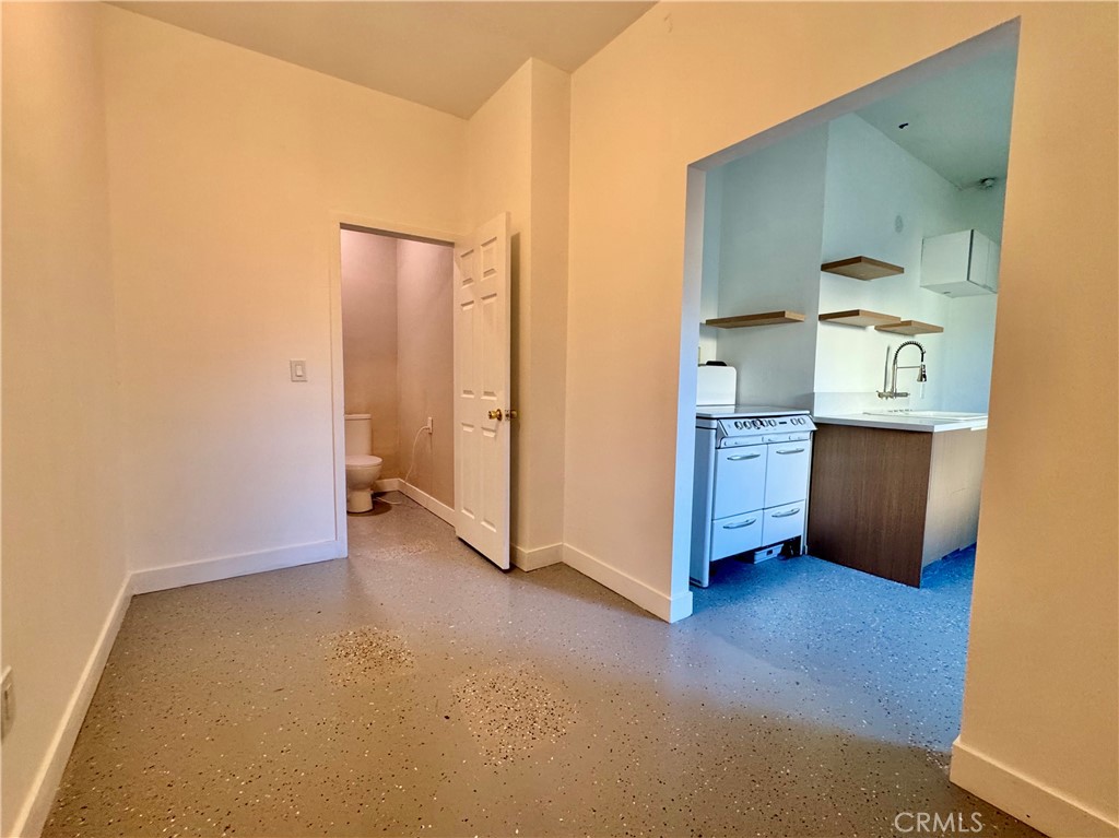 3944 East 9th Street Pomona, CA 91766 - Photo 16 of 22 a view of an empty room with a kitchen
