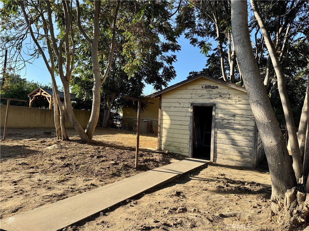 3944 East 9th Street Pomona, CA 91766 - Photo 19 of 22 a front view of a house with a yard