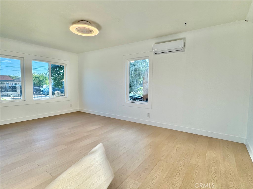 3944 East 9th Street Pomona, CA 91766 - Photo 5 of 22 an empty room with a window