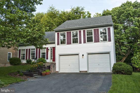 2803 Deer Ridge Drive Silver Spring, MD 20904 - Photo 2 of 30 a front view of a house with a garden