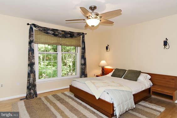 2803 Deer Ridge Drive Silver Spring, MD 20904 - Photo 15 of 30 a bedroom with a large bed and a window