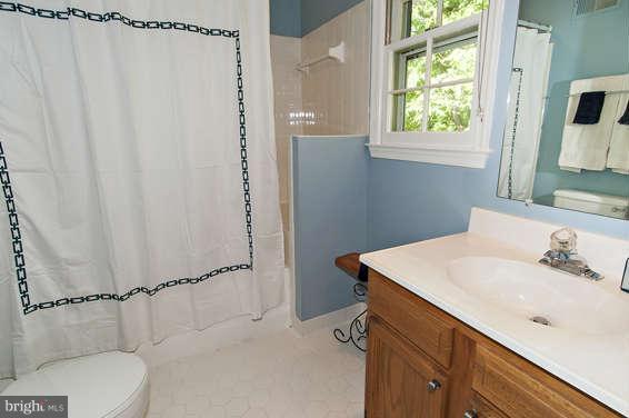 2803 Deer Ridge Drive Silver Spring, MD 20904 - Photo 18 of 30 a bathroom with a sink toilet and shower
