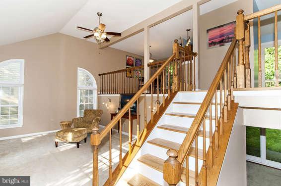 2803 Deer Ridge Drive Silver Spring, MD 20904 - Photo 3 of 30 a view of staircase with lots of frames on wall and windows
