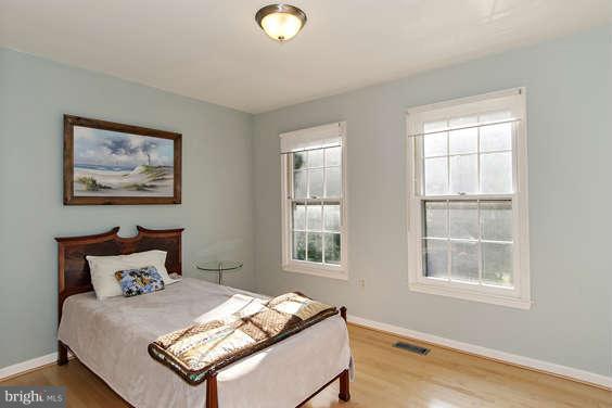 2803 Deer Ridge Drive Silver Spring, MD 20904 - Photo 21 of 30 a bedroom with bed and two windows