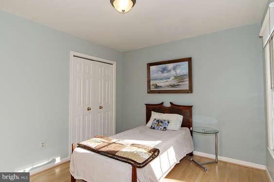 2803 Deer Ridge Drive Silver Spring, MD 20904 - Photo 22 of 30 a bedroom with a bed and a painting on the wall