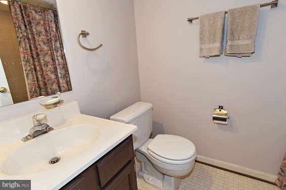 2803 Deer Ridge Drive Silver Spring, MD 20904 - Photo 26 of 30 a bathroom with a sink a toilet and mirror