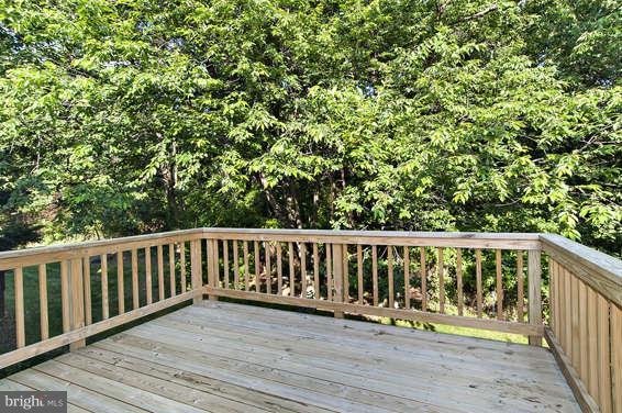 2803 Deer Ridge Drive Silver Spring, MD 20904 - Photo 28 of 30 a balcony with wooden floor and fence