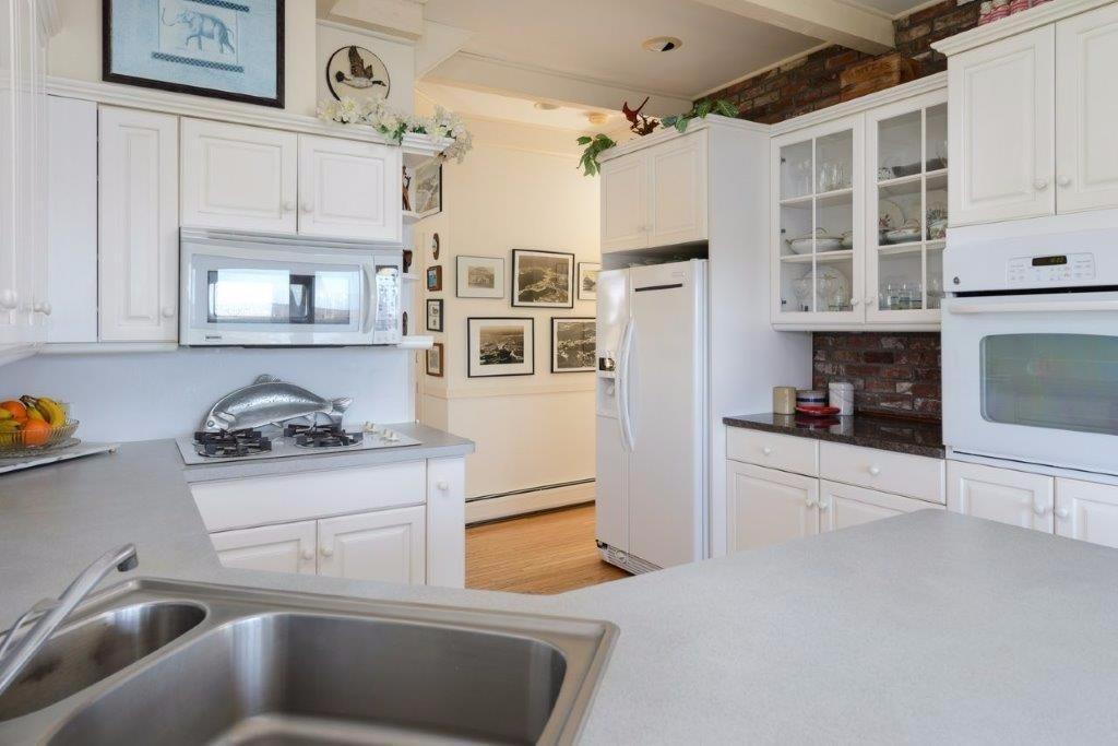 333 Mill Road Falmouth, MA 02540 - Photo 13 of 28 a kitchen with stainless steel appliances granite countertop a stove and a sink